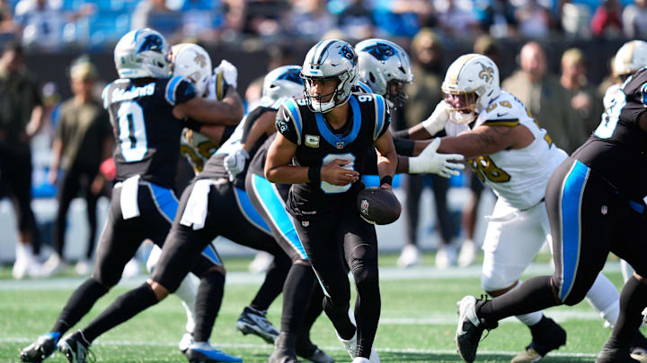 Nov 9, 2025; Charlotte, North Carolina, USA; Carolina Panthers quarterback Bryce Young (9) hands the ball off during the first quarter against the New Orleans Saints at Bank of America Stadium. Mandatory Credit: Jim Dedmon-Imagn Images Nov 9, 2025; Charlotte, North Carolina, USA; Carolina Panthers quarterback Bryce Young (9) hands the ball off during the first quarter against the New Orleans Saints at Bank of America Stadium. Mandatory Credit: Jim Dedmon-Imagn Images