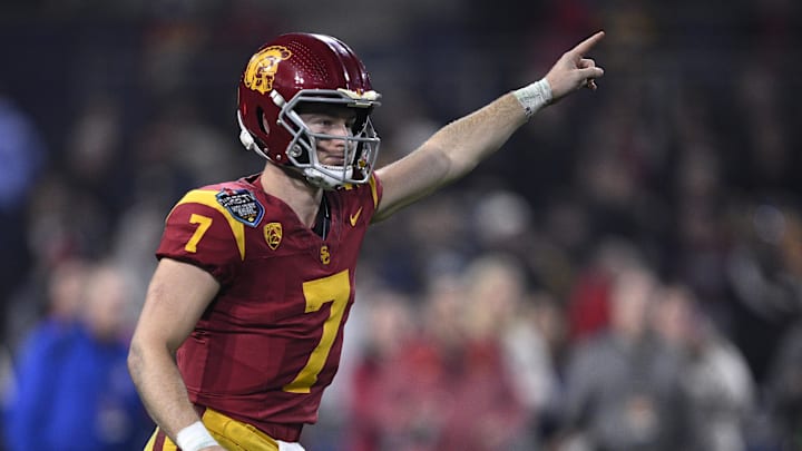 Dec 27, 2023; San Diego, CA, USA; USC Trojans quarterback Miller Moss (7) gestures during a running play against the Louisville Cardinals in the second half at Petco Park. Mandatory Credit: Orlando Ramirez-Imagn Images Dec 27, 2023; San Diego, CA, USA; USC Trojans quarterback Miller Moss (7) gestures during a running play against the Louisville Cardinals in the second half at Petco Park. Mandatory Credit: Orlando Ramirez-Imagn Images