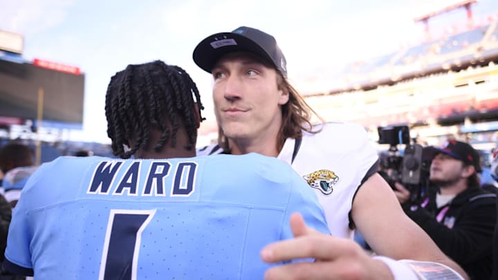 Nov 30, 2025; Nashville, Tennessee, USA; Tennessee Titans quarterback Cam Ward (1)  hugs Jacksonville Jaguars quarterback Trevor Lawrence (16) following a game at Nissan Stadium. Mandatory Credit: Steve Roberts-Imagn Images