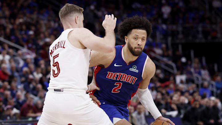 May 13, 2026; Detroit, Michigan, USA; Detroit Pistons guard Cade Cunningham (2) dribbles defended by Cleveland Cavaliers guard Sam Merrill (5) in the second half during game five of the second round of the 2026 NBA Playoffs at Little Caesars Arena. Mandatory Credit: Rick Osentoski-Imagn Images