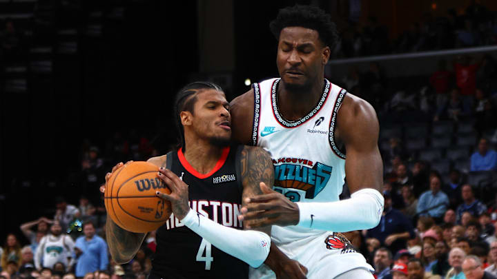 Jan 30, 2025; Memphis, Tennessee, USA; Houston Rockets guard Jalen Green (4) drives to the basket as Memphis Grizzlies forward Jaren Jackson Jr. (13) defends during the fourth quarter at FedExForum. Mandatory Credit: Petre Thomas-Imagn Images Jan 30, 2025; Memphis, Tennessee, USA; Houston Rockets guard Jalen Green (4) drives to the basket as Memphis Grizzlies forward Jaren Jackson Jr. (13) defends during the fourth quarter at FedExForum. Mandatory Credit: Petre Thomas-Imagn Images
