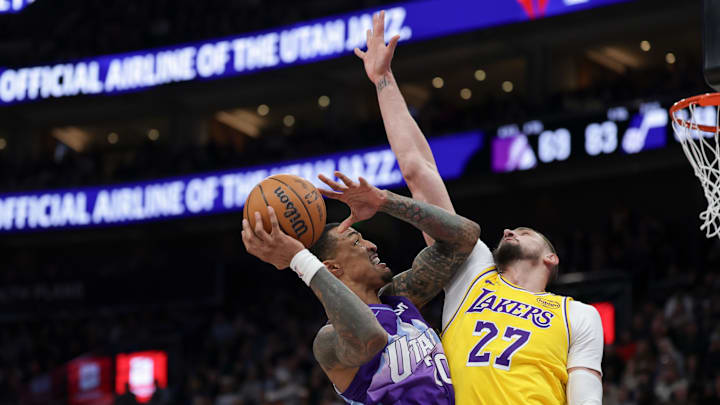 Feb 12, 2025; Salt Lake City, Utah, USA;  Utah Jazz forward John Collins (20) shoots against Los Angeles Lakers center Alex Len (27) during the second half at Delta Center. Mandatory Credit: Chris Nicoll-Imagn Images