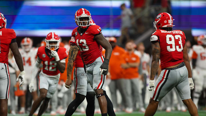 Aug 31, 2024; Atlanta, Georgia, USA; Georgia Bulldogs defensive lineman Mykel Williams (13) celebrates after a tackle against the Clemson Tigers in the third quarter at Mercedes-Benz Stadium. Mandatory Credit: Brett Davis-Imagn Images