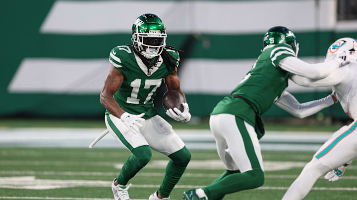 Jan 5, 2025; East Rutherford, New Jersey, USA; New York Jets wide receiver Davante Adams (17) gains yards after catch during the first quarter against the Miami Dolphins at MetLife Stadium. Mandatory Credit: Vincent Carchietta-Imagn Images