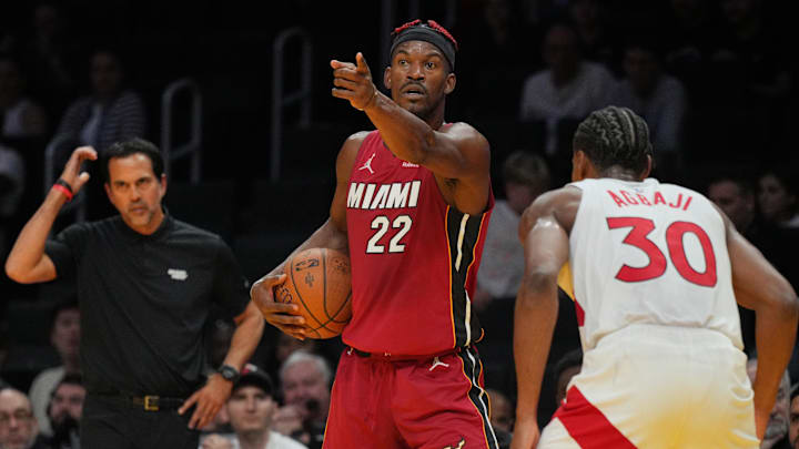 Nov 29, 2024; Miami, Florida, USA; Miami Heat forward Jimmy Butler (22) directs the offense as Toronto Raptors guard Ochai Agbaji (30) defends during the second half in an NBA Cup game at Kaseya Center. Mandatory Credit: Jim Rassol-Imagn Images Nov 29, 2024; Miami, Florida, USA; Miami Heat forward Jimmy Butler (22) directs the offense as Toronto Raptors guard Ochai Agbaji (30) defends during the second half in an NBA Cup game at Kaseya Center. Mandatory Credit: Jim Rassol-Imagn Images