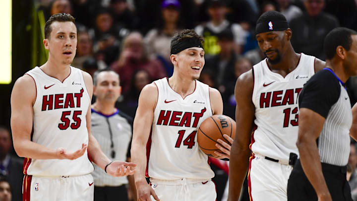 Dec 31, 2022; Salt Lake City, Utah, USA; Miami Heat forward Duncan Robinson (55), center/forward Bam Adebayo (13), and guard Tyler Herro (14) react after a call against the Utah Jazz during the second half at Vivint Arena. Mandatory Credit: Christopher Creveling-Imagn Images