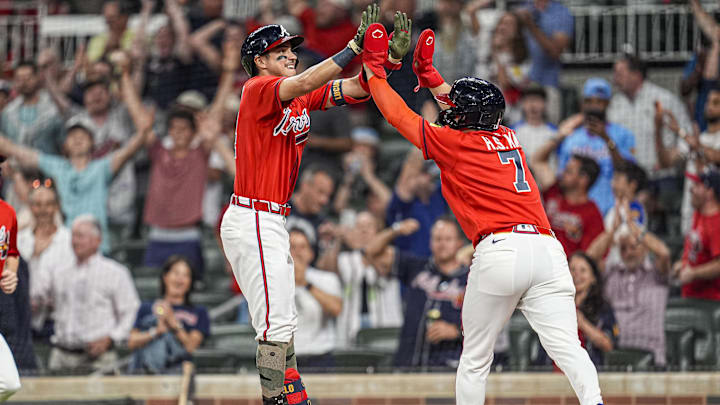 May 15, 2026; Cumberland, Georgia, USA; Atlanta Braves shortstop Ha-Seong Kim (7) reacts with shortstop Mauricio Dubon (14) after scoring the winning run against the Boston Red Sox during the tenth inning at Truist Park. Mandatory Credit: Dale Zanine-Imagn Images