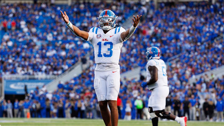 Sep 6, 2025; Lexington, Kentucky, USA; Mississippi Rebels quarterback Austin Simmons (13) celebrates after scoring a touchdown during the fourth quarter against the Kentucky Wildcats at Kroger Field. Mandatory Credit: Jordan Prather-Imagn Images