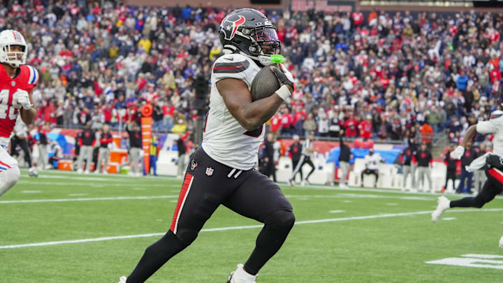 Oct 13, 2024; Foxborough, Massachusetts, USA; Houston Texans running back Dameon Pierce (31) runs with the ball for a touchdown against the New England Patriots during the second half at Gillette Stadium. Mandatory Credit: Gregory Fisher-Imagn Images