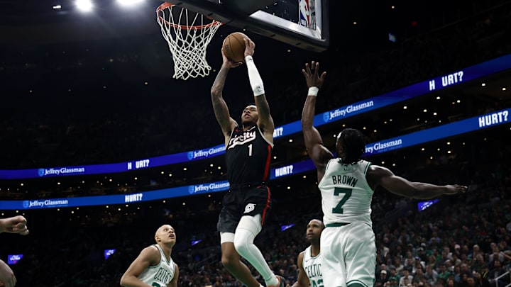 Mar 5, 2025; Boston, Massachusetts, USA; Portland Trail Blazers guard Anfernee Simons (1) goes to the basket past Boston Celtics guard Jaylen Brown (7) during the second half at TD Garden. Mandatory Credit: Winslow Townson-Imagn Images