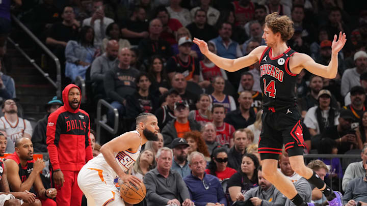 Mar 19, 2025; Phoenix, Arizona, USA; Chicago Bulls forward Matas Buzelis (14) defends against Phoenix Suns forward Cody Martin (17) during the first half at PHX Aena. Mandatory Credit: Joe Camporeale-Imagn Images Mar 19, 2025; Phoenix, Arizona, USA; Chicago Bulls forward Matas Buzelis (14) defends against Phoenix Suns forward Cody Martin (17) during the first half at PHX Aena. Mandatory Credit: Joe Camporeale-Imagn Images