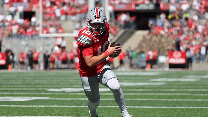 Sep 26, 2026; Columbus, Ohio, USA; Ohio State Buckeyes quarterback Julian Sayin (10) scores a rushing touchdown against the Illinois Fighting Illini during the first half at Ohio Stadium. Mandatory Credit: Joseph Maiorana-Imagn Images Sep 26, 2026; Columbus, Ohio, USA; Ohio State Buckeyes quarterback Julian Sayin (10) scores a rushing touchdown against the Illinois Fighting Illini during the first half at Ohio Stadium. Mandatory Credit: Joseph Maiorana-Imagn Images