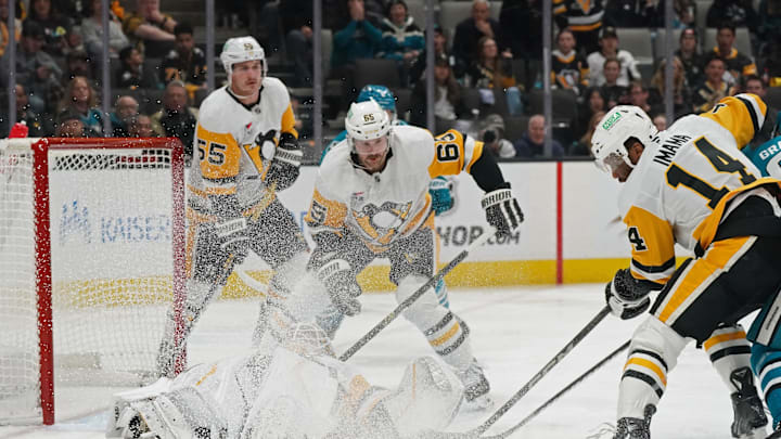 Jan 27, 2025; San Jose, California, USA;  Pittsburgh Penguins center Noel Acciari (55), defenseman Erik Karlsson (65) and left winger Bokondji Imama (14) look for the puck as Pittsburgh Penguins goalie Alex Nedeljkovic (39) defends the goal in the second period at SAP Center at San Jose. Mandatory Credit: David Gonzales-Imagn Images