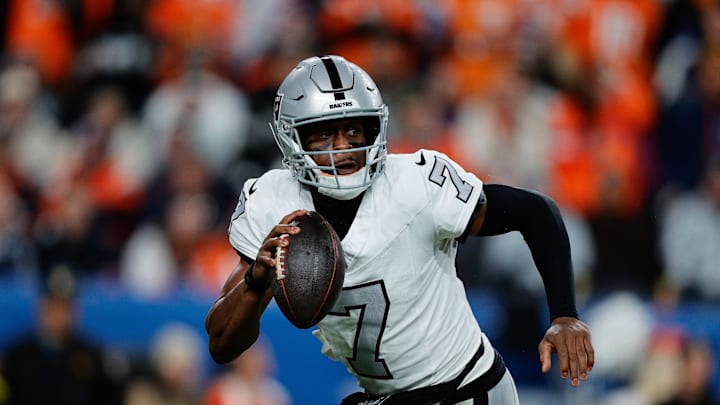 Nov 6, 2025; Denver, Colorado, USA; Las Vegas Raiders quarterback Geno Smith (7) scrambles with the ball in the fourth quarter against the Denver Broncos at Empower Field at Mile High. Mandatory Credit: Isaiah J. Downing-Imagn Images