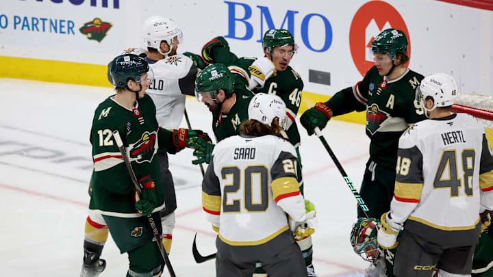 Apr 26, 2025; Saint Paul, Minnesota, USA; Minnesota Wild defenseman Jared Spurgeon (46) takes a punch from Vegas Golden Knights defenseman Alex Pietrangelo (7) during 1st OT in game four of the first round of the 2025 Stanley Cup Playoffs at Xcel Energy Center. Mandatory Credit: Bruce Fedyck-Imagn Images