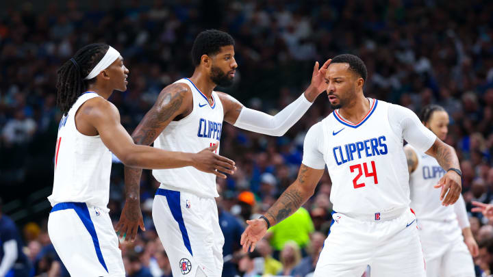 Apr 28, 2024; Dallas, Texas, USA;  LA Clippers guard Terance Mann (14) and LA Clippers forward Paul George (13) and LA Clippers guard Norman Powell (24) react  during the first quarter against the Dallas Mavericks during game four of the first round for the 2024 NBA playoffs at American Airlines Center. Mandatory Credit: Kevin Jairaj-USA TODAY Sports