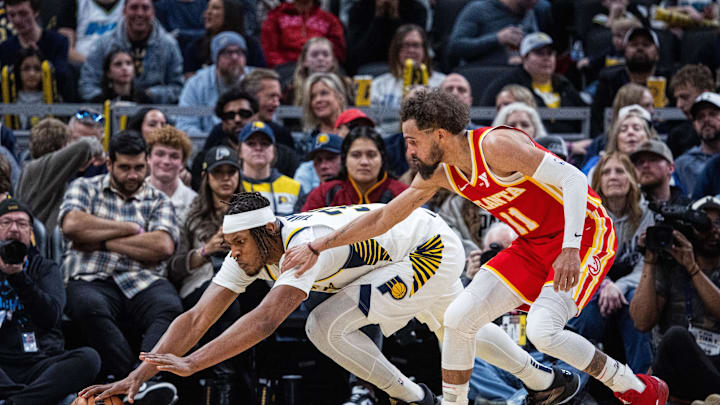 Feb 1, 2025; Indianapolis, Indiana, USA; Indiana Pacers center Myles Turner (33) dives for a loose ball against Atlanta Hawks guard Trae Young (11) in the second half at Gainbridge Fieldhouse. Mandatory Credit: Trevor Ruszkowski-Imagn Images Feb 1, 2025; Indianapolis, Indiana, USA; Indiana Pacers center Myles Turner (33) dives for a loose ball against Atlanta Hawks guard Trae Young (11) in the second half at Gainbridge Fieldhouse. Mandatory Credit: Trevor Ruszkowski-Imagn Images