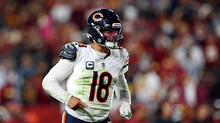 Oct 27, 2024; Landover, Maryland, USA; Chicago Bears quarterback Caleb Williams (18) celebrates after the Bears scored a touchdown during the fourth quarter against the Washington Commanders at Commanders Field. Mandatory Credit: Peter Casey-Imagn Images
