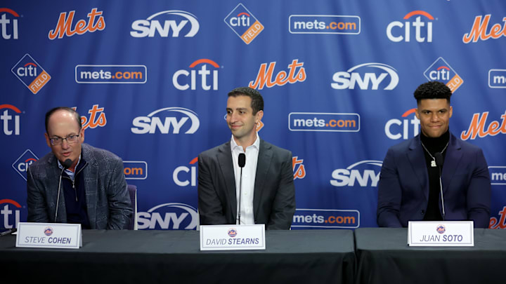 Dec 12, 2024; Flushing, NY, USA; New York Mets owner Steve Cohen speaks next to general manager David Stearns during a press conference to introduce right fielder Juan Soto at Citi Field. Mandatory Credit: Brad Penner-Imagn Images