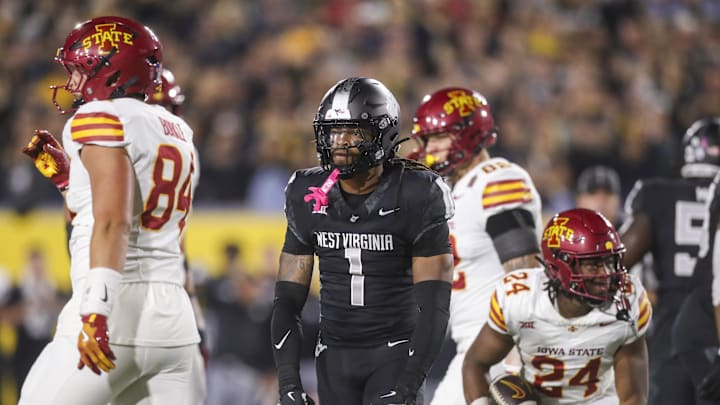 Oct 12, 2024; Morgantown, West Virginia, USA; West Virginia Mountaineers cornerback Garnett Hollis Jr. (1) celebrates after a defensive stop against the Iowa State Cyclones during the first quarter  at Mountaineer Field at Milan Puskar Stadium. Mandatory Credit: Ben Queen-Imagn Images