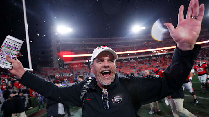 Georgia Offensive Coordinator Mike Bobo celebrates after wining a NCAA college football game against Ole Miss in Athens, Ga., on Saturday, Nov. 11, 2023. Georgia won 52-17. Georgia Offensive Coordinator Mike Bobo celebrates after wining a NCAA college football game against Ole Miss in Athens, Ga., on Saturday, Nov. 11, 2023. Georgia won 52-17.