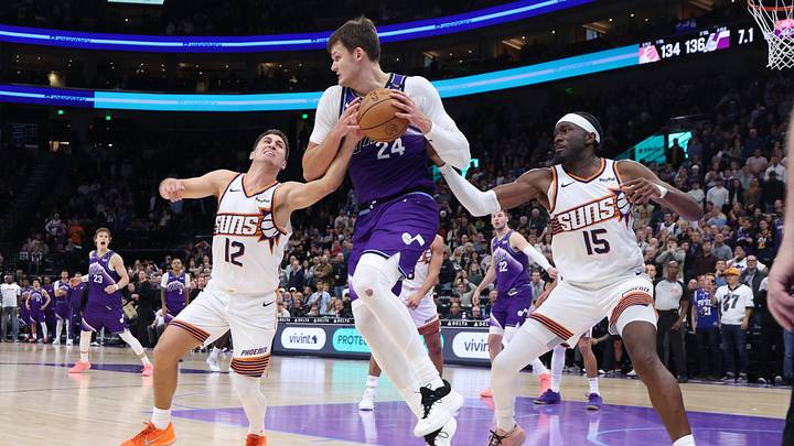 Oct 27, 2025; Salt Lake City, Utah, USA; Utah Jazz center Walker Kessler (24) rebounds against Phoenix Suns guard Collin Gillespie (12) and center Mark Williams (15) during overtime at Delta Center. Mandatory Credit: Rob Gray-Imagn Images Oct 27, 2025; Salt Lake City, Utah, USA; Utah Jazz center Walker Kessler (24) rebounds against Phoenix Suns guard Collin Gillespie (12) and center Mark Williams (15) during overtime at Delta Center. Mandatory Credit: Rob Gray-Imagn Images