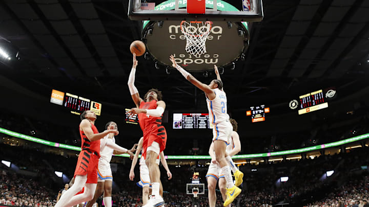 Mar 6, 2024; Portland, Oregon, USA; Portland Trail Blazers shooting guard Matisse Thybulle (4) shoots the ball against Oklahoma City Thunder shooting guard Aaron Wiggins (21) during the first half at Moda Center. Mandatory Credit: Soobum Im-Imagn Images