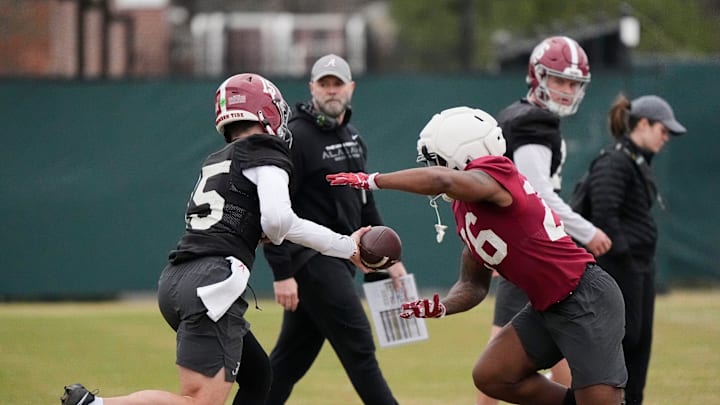 Mar 5, 2025; Tuscaloosa, AL, USA; Quarterback Ty Simpson (15) hands off to running back Jam Miller (26) during Spring Practice for the Crimson Tide. Mar 5, 2025; Tuscaloosa, AL, USA; Quarterback Ty Simpson (15) hands off to running back Jam Miller (26) during Spring Practice for the Crimson Tide.