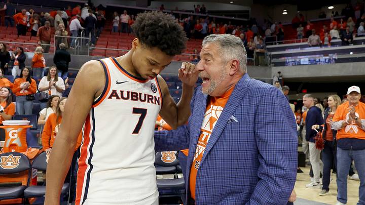 Feb 21, 2026; Auburn, Alabama, USA;  Auburn Tigers guard Keyshawn Hall (7) talks with former head coach Bruce Pearl after the Tigers beat the Kentucky Wildcats at Neville Arena.