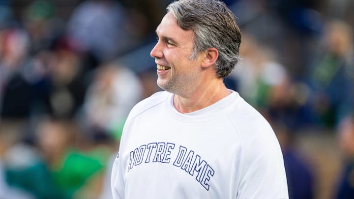 Notre Dame football coach watches the action against USC