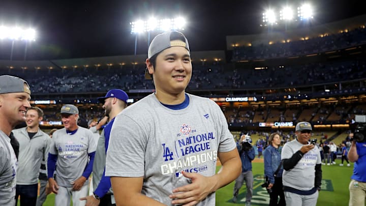 Los Angeles Dodgers two-way player Shohei Ohtani (17) celebrates after beating the New York Mets during game six of the NLCS for the 2024 MLB playoffs at Dodger Stadium.