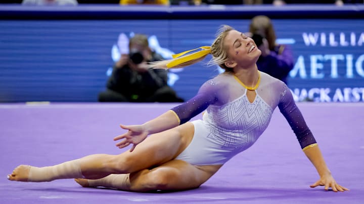 LSU Lady Tigers senior Olivia \"Livvy\" Dunne performs a floor routine against the Arkansas Razorbacks at Pete Maravich Assembly Center. 