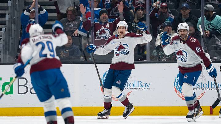 Mar 12, 2026; Seattle, Washington, USA; Colorado Avalanche forward Martin Necas (88), center, celebrates a goal with forward Nazem Kadri (91) and forward Nathan MacKinnon (29) during the first period against the Seattle Kraken at Climate Pledge Arena. Mandatory Credit: Stephen Brashear-Imagn Images
