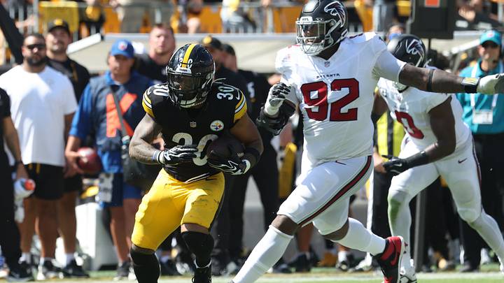Sep 13, 2026; Pittsburgh, Pennsylvania, USA;  Pittsburgh Steelers running back Jaylen Warren (30) runs after a catch against Atlanta Falcons defensive tackle Maason Smith (92) during the second quarter at Acrisure Stadium.  Mandatory Credit: Charles LeClaire-Imagn Images