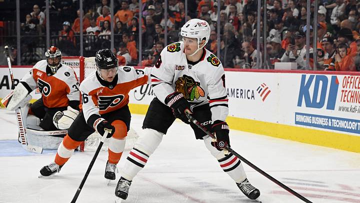 Mar 26, 2026; Philadelphia, Pennsylvania, USA; Chicago Blackhawks center Ryan Donato (8) is defended by Philadelphia Flyers defenseman Emil Andrae (36) during the second period at Xfinity Mobile Arena. Mandatory Credit: Eric Hartline-Imagn Images