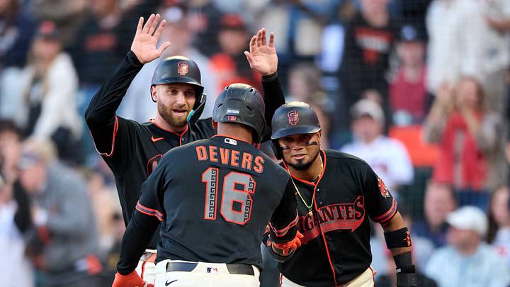 San Francisco Giants infielder Rafael Devers (16) celebrates with outfielder Casey Schmitt (10) and infielder Luis Arraez (1). San Francisco Giants infielder Rafael Devers (16) celebrates with outfielder Casey Schmitt (10) and infielder Luis Arraez (1).