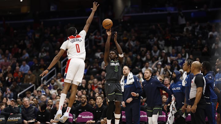 Jan 13, 2025; Washington, District of Columbia, USA; Minnesota Timberwolves guard Anthony Edwards (5) shoots the ball over Washington Wizards guard Bilal Coulibaly (0) in the fourth quarter at Capital One Arena. Mandatory Credit: Geoff Burke-Imagn Images