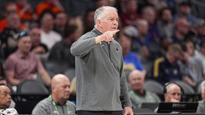 Mar 11, 2025; Charlotte, NC, USA; Virginia Tech Hokies head coach Mike Young signals to his team during the first half against the California Golden Bears at Spectrum Center. Mandatory Credit: Jim Dedmon-Imagn Images