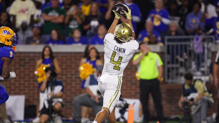 Nov 22, 2025; Atlanta, Georgia, USA; Georgia Tech Yellow Jackets wide receiver Isiah Canion (4) catches a pass for a touchdown against the Pittsburgh Panthers in the second quarter at Bobby Dodd Stadium at Hyundai Field. Mandatory Credit: Brett Davis-Imagn Images
