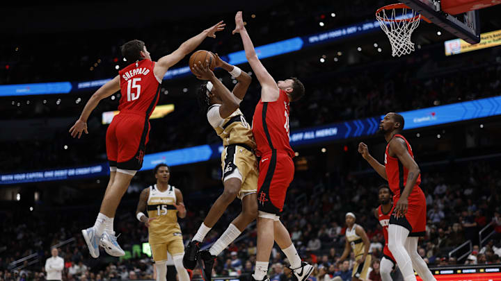 Mar 2, 2026; Washington, District of Columbia, USA; Washington Wizards guard Tre Johnson (12) is fouled while shooting by Houston Rockets guard Reed Sheppard (15) as Houston Rockets center Alperen Sengun (28) defends in the first half at Capital One Arena. Mandatory Credit: Geoff Burke-Imagn Images Mar 2, 2026; Washington, District of Columbia, USA; Washington Wizards guard Tre Johnson (12) is fouled while shooting by Houston Rockets guard Reed Sheppard (15) as Houston Rockets center Alperen Sengun (28) defends in the first half at Capital One Arena. Mandatory Credit: Geoff Burke-Imagn Images