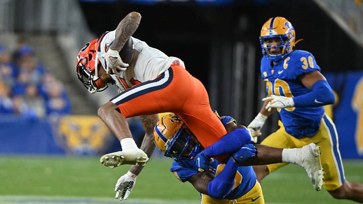 Oct 24, 2024; Pittsburgh, Pennsylvania, USA; PPittsburgh Panthers linebacker Kyle Louis (9) tackles Syracuse Orange wide receiver Umari Hatcher (5) during the second quarter at Acrisure Stadium. Mandatory Credit: Barry Reeger-Imagn Images Oct 24, 2024; Pittsburgh, Pennsylvania, USA; PPittsburgh Panthers linebacker Kyle Louis (9) tackles Syracuse Orange wide receiver Umari Hatcher (5) during the second quarter at Acrisure Stadium. Mandatory Credit: Barry Reeger-Imagn Images