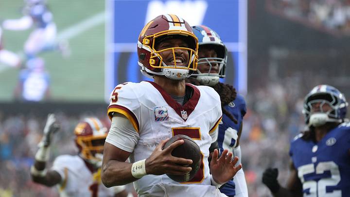 Oct 11, 2026; Landover, Maryland, USA;  Washington Commanders quarterback Jayden Daniels (5) celebrates scoring a touchdown during the fourth quarter against the New York Giants at Northwest Stadium.  Mandatory Credit: Amber Searls-Imagn Images
