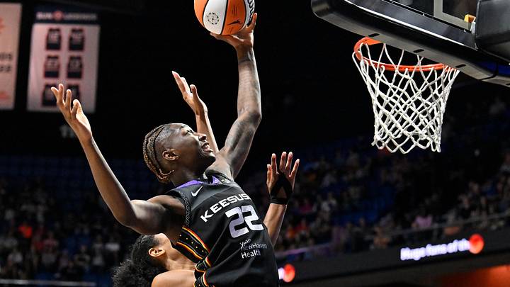 Aug 13, 2025; Uncasville, Connecticut, USA; Connecticut Sun guard Saniya Rivers (22) reaches for the rebound during the second half against the Chicago Sky at Mohegan Sun Arena. Mandatory Credit: Eric Canha-Imagn Images