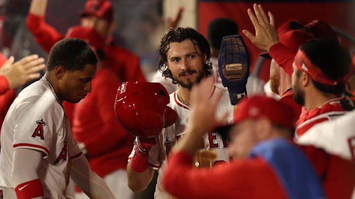 Aug 4, 2025; Anaheim, California, USA; Los Angeles Angels center fielder Bryce Teodosio (22) is greeted in the dugout after scoring a run during the sixth inning against the Tampa Bay Rays at Angel Stadium. Mandatory Credit: Kiyoshi Mio-Imagn Images Aug 4, 2025; Anaheim, California, USA; Los Angeles Angels center fielder Bryce Teodosio (22) is greeted in the dugout after scoring a run during the sixth inning against the Tampa Bay Rays at Angel Stadium. Mandatory Credit: Kiyoshi Mio-Imagn Images