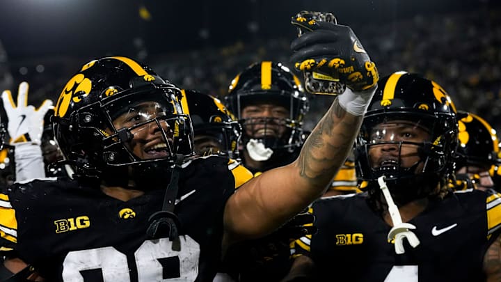 Iowa Hawkeyes running back Kamari Moulton (28) takes a video as he and teammates celebrate defeating the Michigan State Spartans Nov. 22, 2025 at Kinnick Stadium in Iowa City, Iowa.