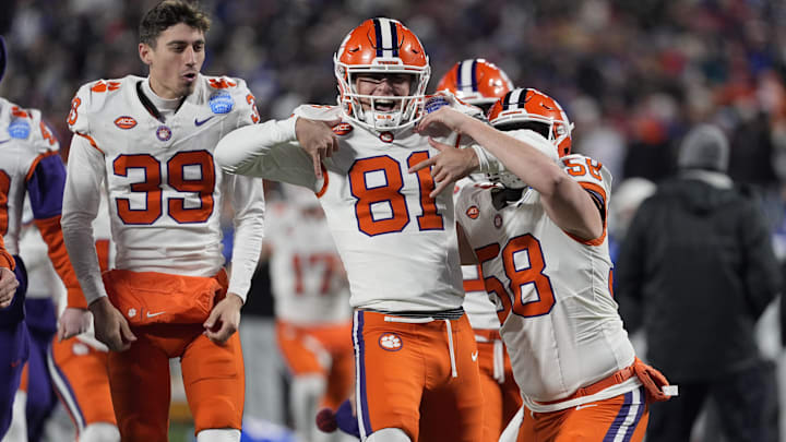 Clemson kicker Nolan Hauser celebrates with teammates after making a 56-yard field goal to beat SMU in the ACC championship.