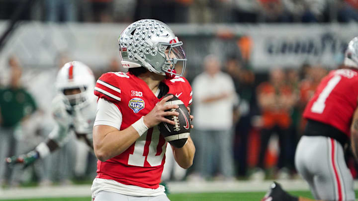 Dec 31, 2025; Arlington, TX, USA; Ohio State Buckeyes quarterback Julian Sayin (10) looks to throw in the first quarter against the Miami Hurricanes during the 2025 Cotton Bowl and quarterfinal game of the College Football Playoff at AT&T Stadium. Mandatory Credit: Raymond Carlin III-Imagn Images