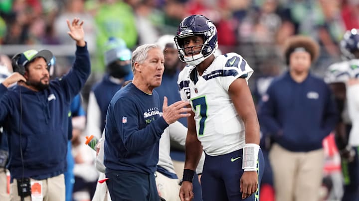 Jan 7, 2024; Glendale, Arizona, USA; Seattle Seahawks head coach Pete Carroll talks with Seattle Seahawks quarterback Geno Smith (7) against the Arizona Cardinals during the first half at State Farm Stadium. Mandatory Credit: Joe Camporeale-Imagn Images Jan 7, 2024; Glendale, Arizona, USA; Seattle Seahawks head coach Pete Carroll talks with Seattle Seahawks quarterback Geno Smith (7) against the Arizona Cardinals during the first half at State Farm Stadium. Mandatory Credit: Joe Camporeale-Imagn Images