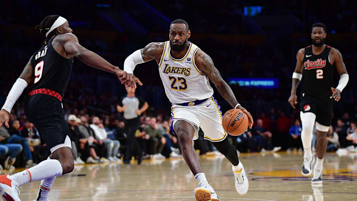 Jan 21, 2024; Los Angeles, California, USA; Los Angeles Lakers forward LeBron James (23) moves the ball against Portland Trail Blazers forward Jerami Grant (9) during the second half at Crypto.com Arena. Mandatory Credit: Gary A. Vasquez-Imagn Images Jan 21, 2024; Los Angeles, California, USA; Los Angeles Lakers forward LeBron James (23) moves the ball against Portland Trail Blazers forward Jerami Grant (9) during the second half at Crypto.com Arena. Mandatory Credit: Gary A. Vasquez-Imagn Images