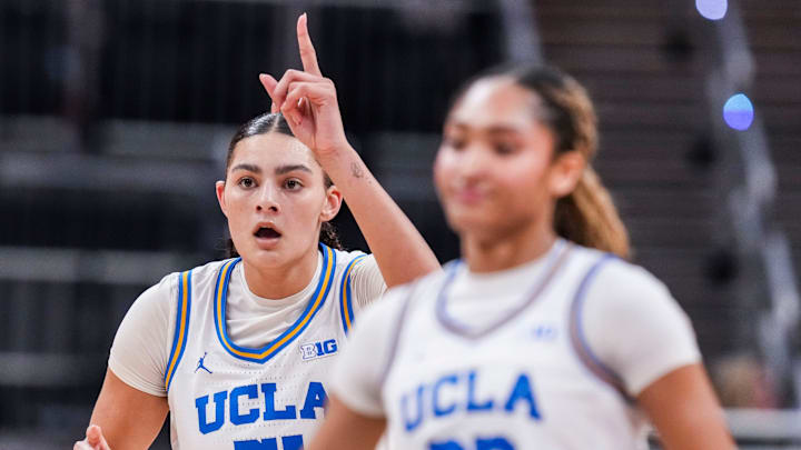 UCLA Bruins center Lauren Betts (51) points up after scoring Saturday, March 8, 2025, in a semifinals game at the 2025 TIAA Big Ten Women's Basketball Tournament between the UCLA Bruins and the Ohio State Buckeyes at Gainbridge Fieldhouse in Indianapolis. UCLA Bruins center Lauren Betts (51) points up after scoring Saturday, March 8, 2025, in a semifinals game at the 2025 TIAA Big Ten Women's Basketball Tournament between the UCLA Bruins and the Ohio State Buckeyes at Gainbridge Fieldhouse in Indianapolis.